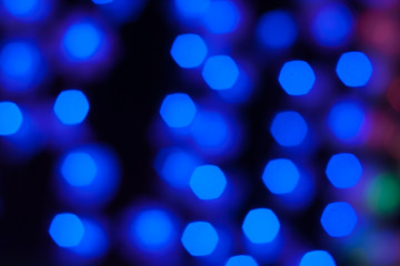 Abstract background of out of focus lights at night. Light hexagon.