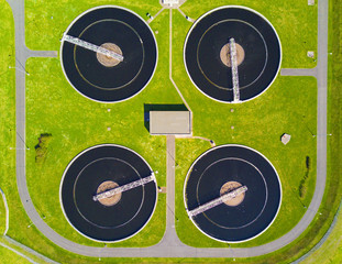 Aerial view of sewage treatment plant. Industrial water treatment for big city from above. 