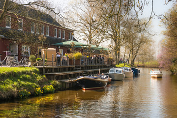 restaurant with boat dock at the canal 