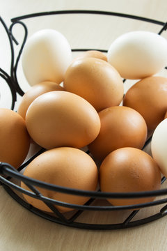 Basket with fresh raw eggs. Scandinavian style. Selective focus. Close-up.