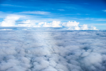 View above white cloud with blue sky