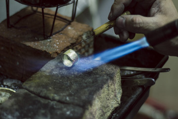 jeweler melts the metal - 5