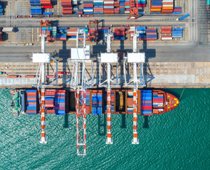 container ship in import export and business logistic.By crane ,Trade Port , Shipping, cargo to...