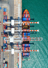container ship in import export and business logistic.By crane ,Trade Port , Shipping, cargo to...