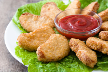 Fried chicken nuggets on wooden table
