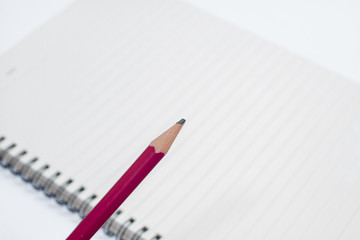 Hand with pencil writing something isolated on white background with shadows