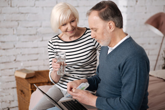 Elderly couple going to take pills