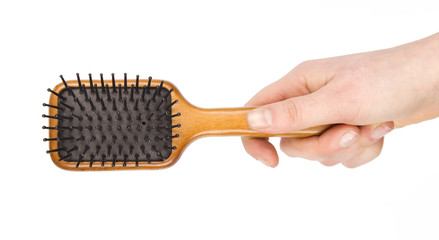 hair comb in hand isolated