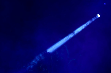 Beam of blue light on black . Applied to a searchlight torch