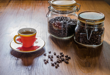 spresso coffee and roasted coffee beans in glass jar