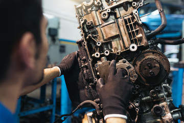 Obraz na płótnie Canvas Professional Mechanic Repairing Car.