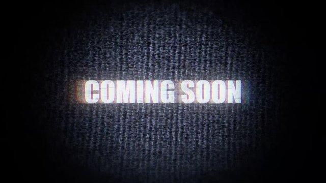 The text Coming soon, with distortions and glitches, appears over static noise from a vignetted TV screen.

