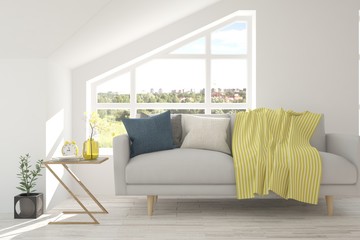 Fototapeta premium White room with sofa and green landscape in window. Scandinavian interior design. 3D illustration