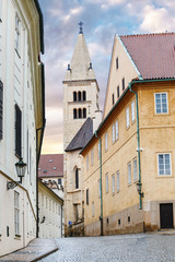 Morning in old city narrow street without people and cars in Prague.