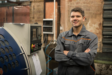 Professional machine operator on production plant