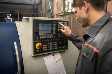 Professional machine operator on production plant