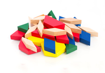 Multicolored wooden blocks.Macro.White wooden background.Isolate.