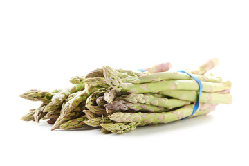 Heap of green asparagus isolated on a white background