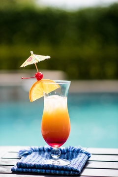 Tropical Alcoholic Drink By Pool With Umbrella