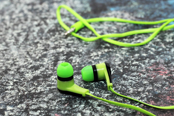 Green headphones on a chalkboard, a musical theme
