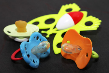 Children's pacifier and colorful bright toys
