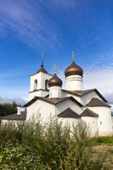 Fototapeta na wymiar View on suspension bridge and St. Nicholas church in Ostrov