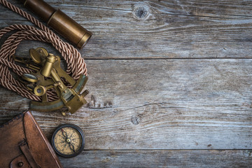 compass,sextant and spyglass on the timber