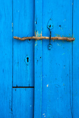 Detail of old blue wooden door.