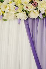 flowers on a white wedding chair in the banquet room