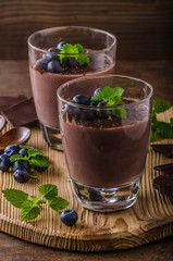 Chocolate pudding with berries and herbs