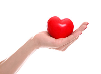 Obraz premium Girl holding red heart on white background