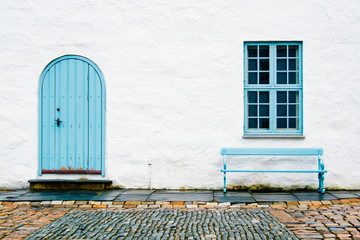 White building with blue accent