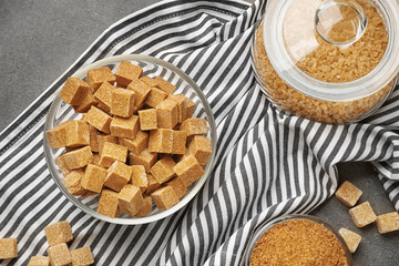 Brown sugar in dishware on napkin