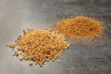 Heaps of brown sugar on table