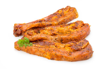 Spicy marinated spare ribs barbecued on the white background.