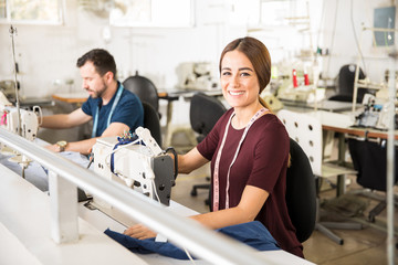 Pretty woman using a sewing machine