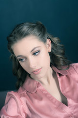 Naklejka premium Retro 1940s beauty portrait of young woman with up hair.