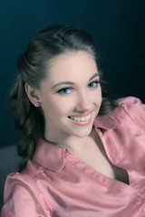 Retro 1940s beauty portrait of young woman with up hair.