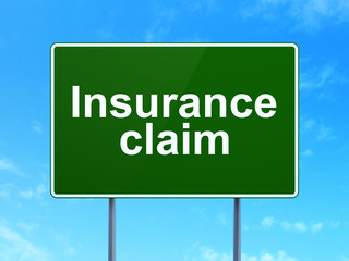 Insurance concept: Insurance Claim on road sign background