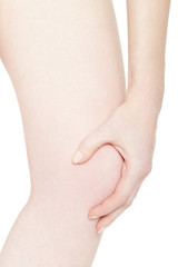 Woman leg with knee pain isolated on white, clipping path