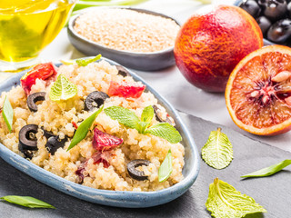 Vegan salad with quinoa, red orange and black olives