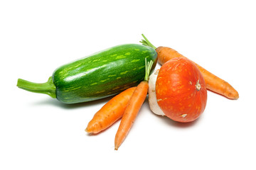 Zucchini, carrots and pumpkin on a white background