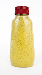 Isolated plastic squeeze bottle of spicy brown mustard with red cap. Vertical.