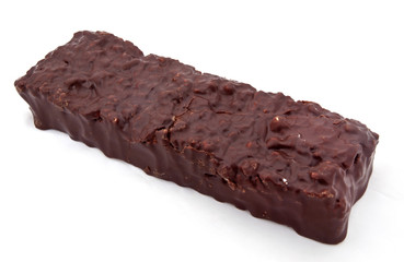 Bumpy chocolate covered candy bar. Isolated.