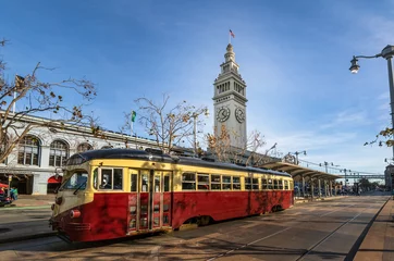 Fotobehang Straatauto of karretje of muni-tram voor San Francisco Ferry Building in Embarcadero - San Francisco, Californië, VS © diegograndi