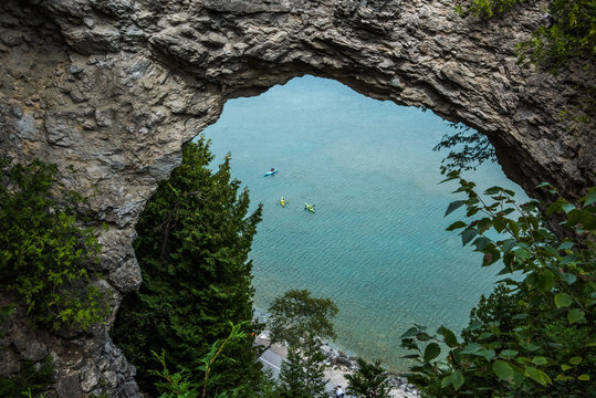 Rock arch with kayakers