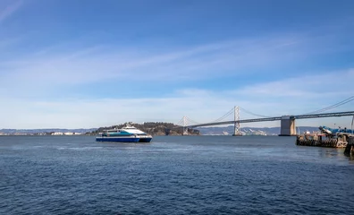 Fotobehang San Francisco Bay Bridge and ferry boat - San Francisco, California, USA © diegograndi