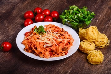 Meat paste. Tagliatelle with beef, pork and tomatoes