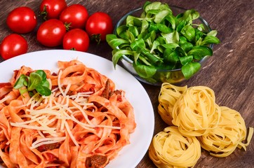Meat paste. Tagliatelle with beef, pork and tomatoes