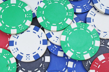 Poker token chips closeup texture studio photo.